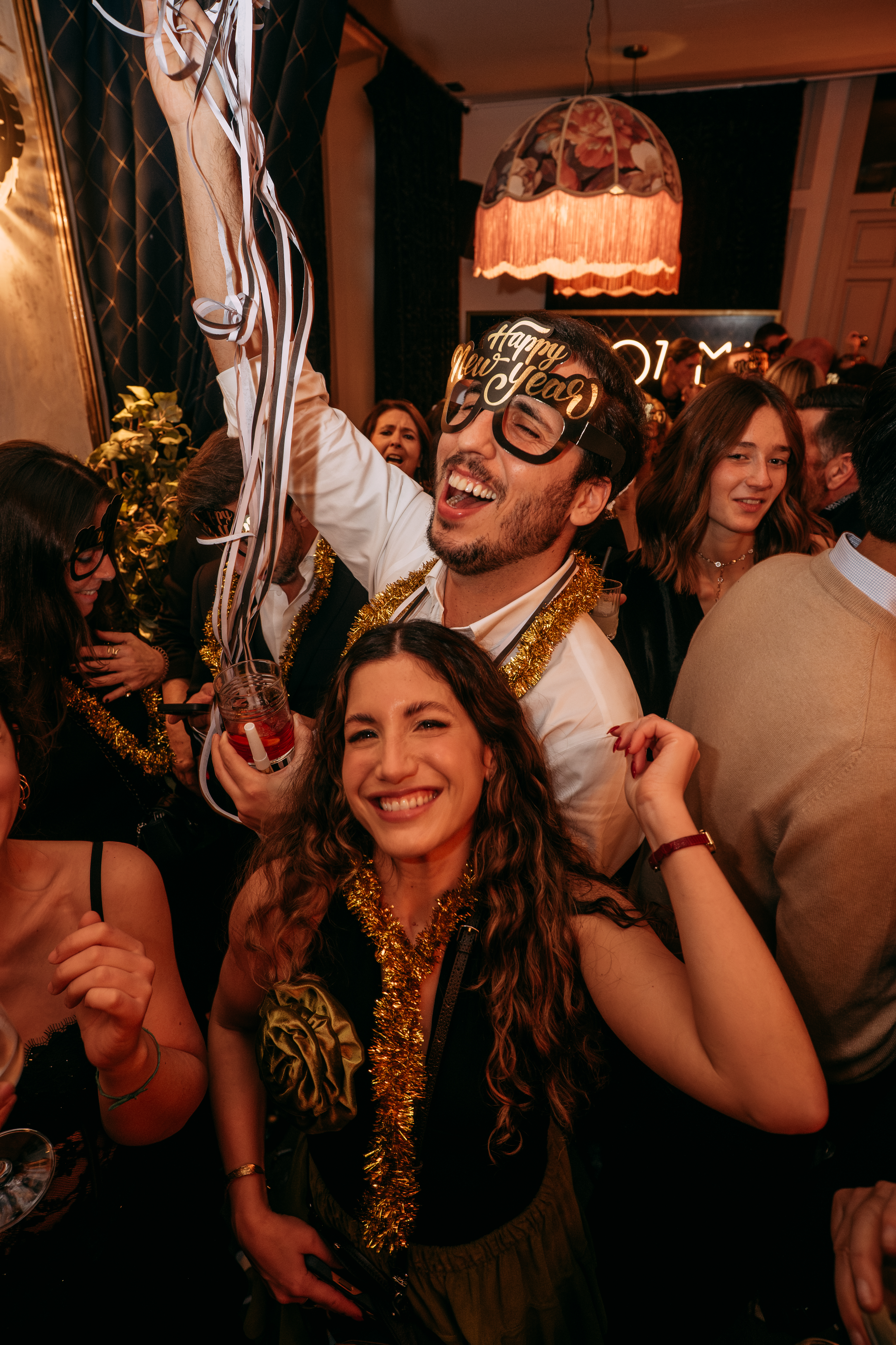 Guests celebrating with party favours at Casa Ozama